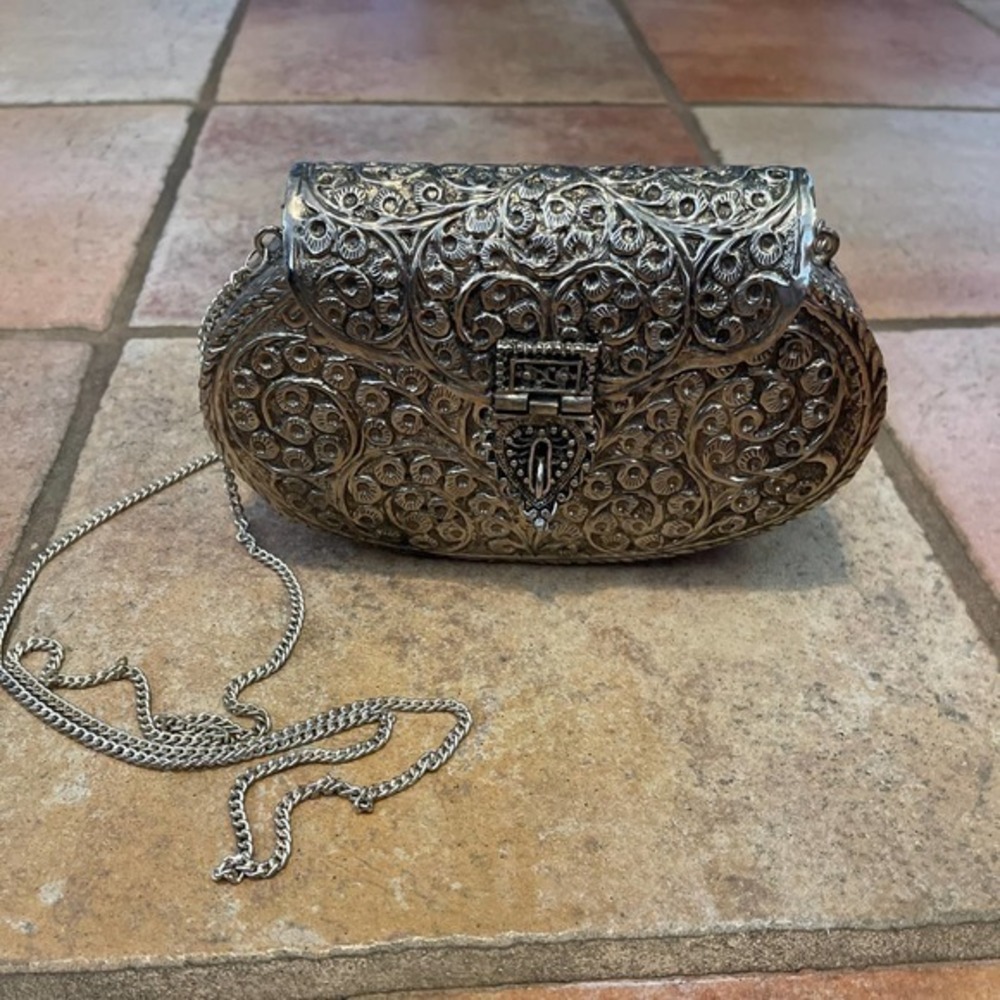 A Nepalese Silvered Metal Bag Patterned With Embossed Leaves...